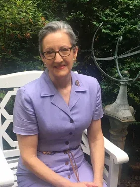 Anne Hale seated outdoors