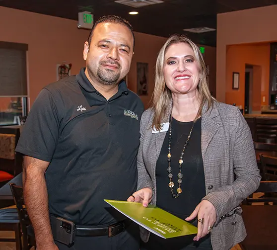 Business development team members holding a toolkit.