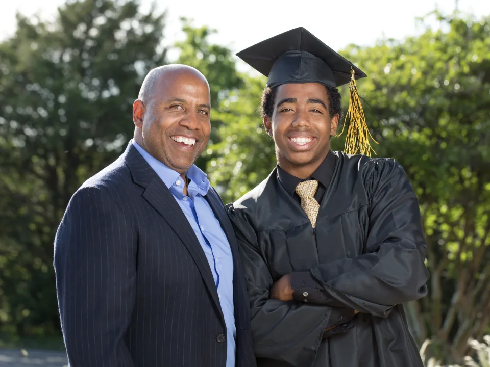 A parent and graduate celebrating together