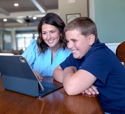 Parent helping a student use online banking